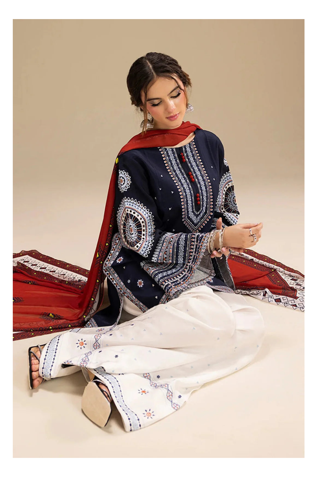 Its 3 piece unstitched Lawn Embroidered Dress IR-21